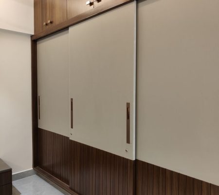 Sliding wardrobe with wooden shutter